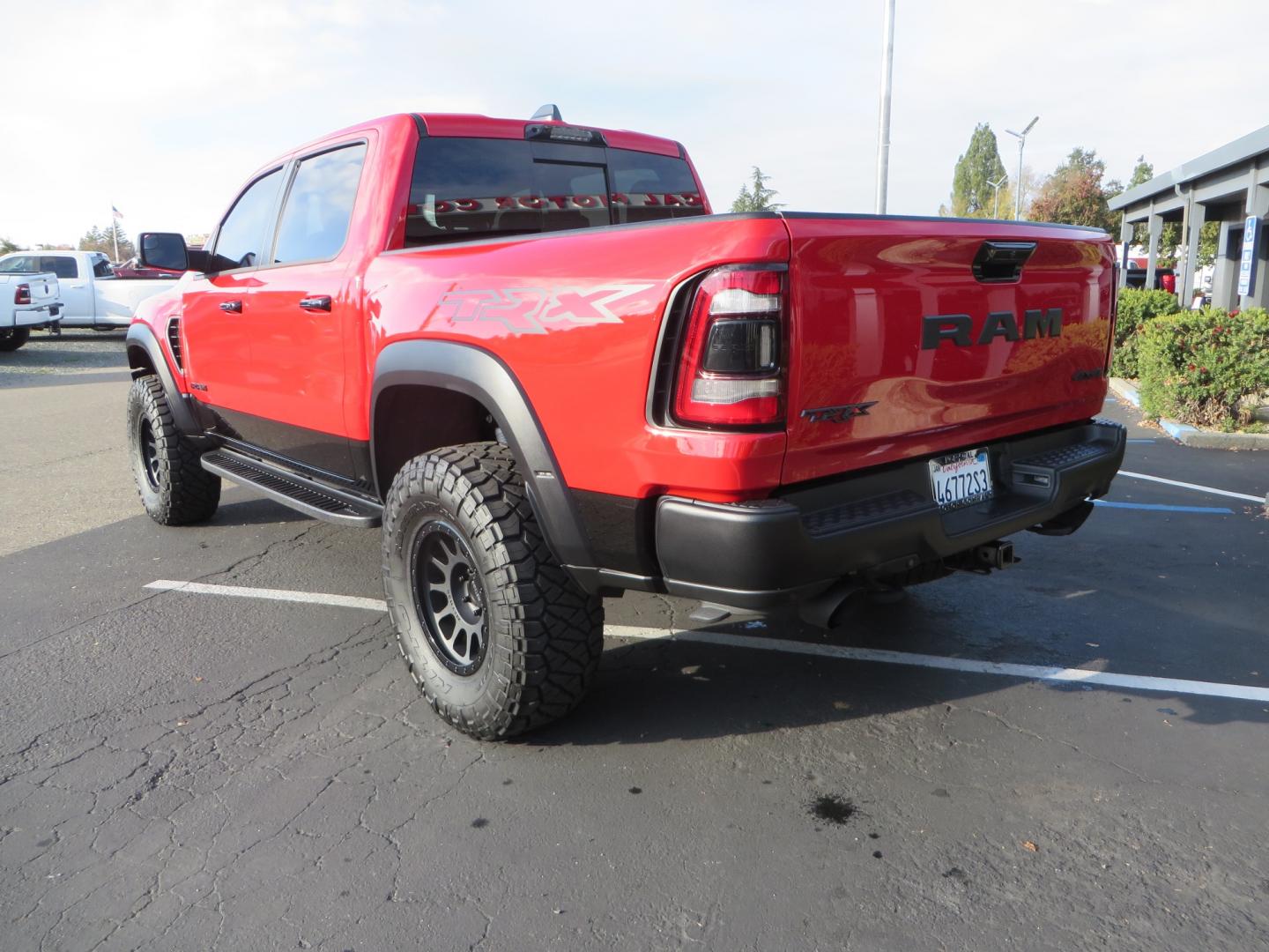 2023 Red /BLACK RAM 1500 Ram 1500 TRX Crew Cab 4x4 (1C6SRFU9XPN) with an 6.2L Supercharged HEMI V8 SRT engine, 8 Speed Auto 8HP95 transmission, located at 2630 Grass Valley Highway, Auburn, CA, 95603, (530) 508-5100, 38.937893, -121.095482 - Must see TRX featuring Eibach front and rear springs, 18" Method NV double black wheels, 37" Nitto Ridge Grappler tires, and window tint. - Photo#7